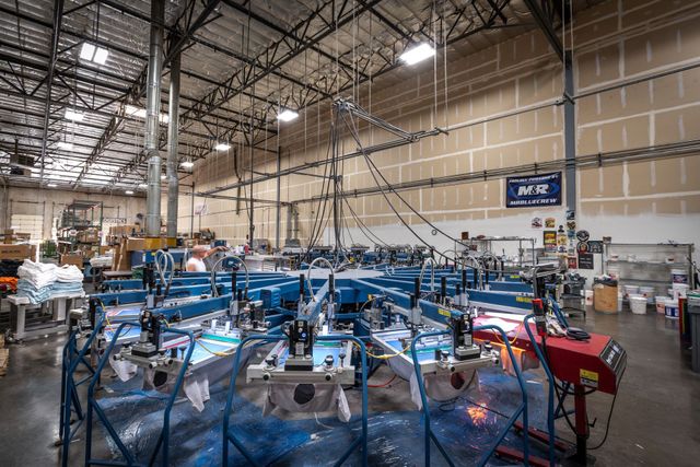 Automatic screen printing press on the Silverscreen production floor